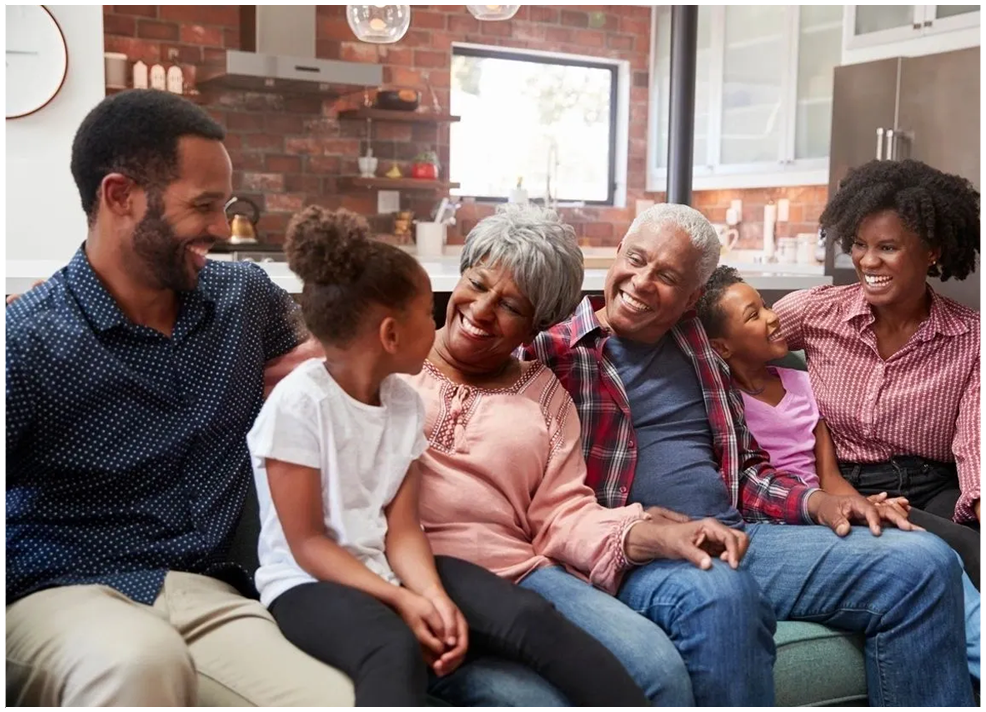 A group of people sitting on top of a couch.